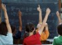 students raising hands