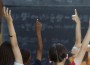 students raising their hands